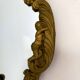 Gilded bronze mirror with angels and scrolls