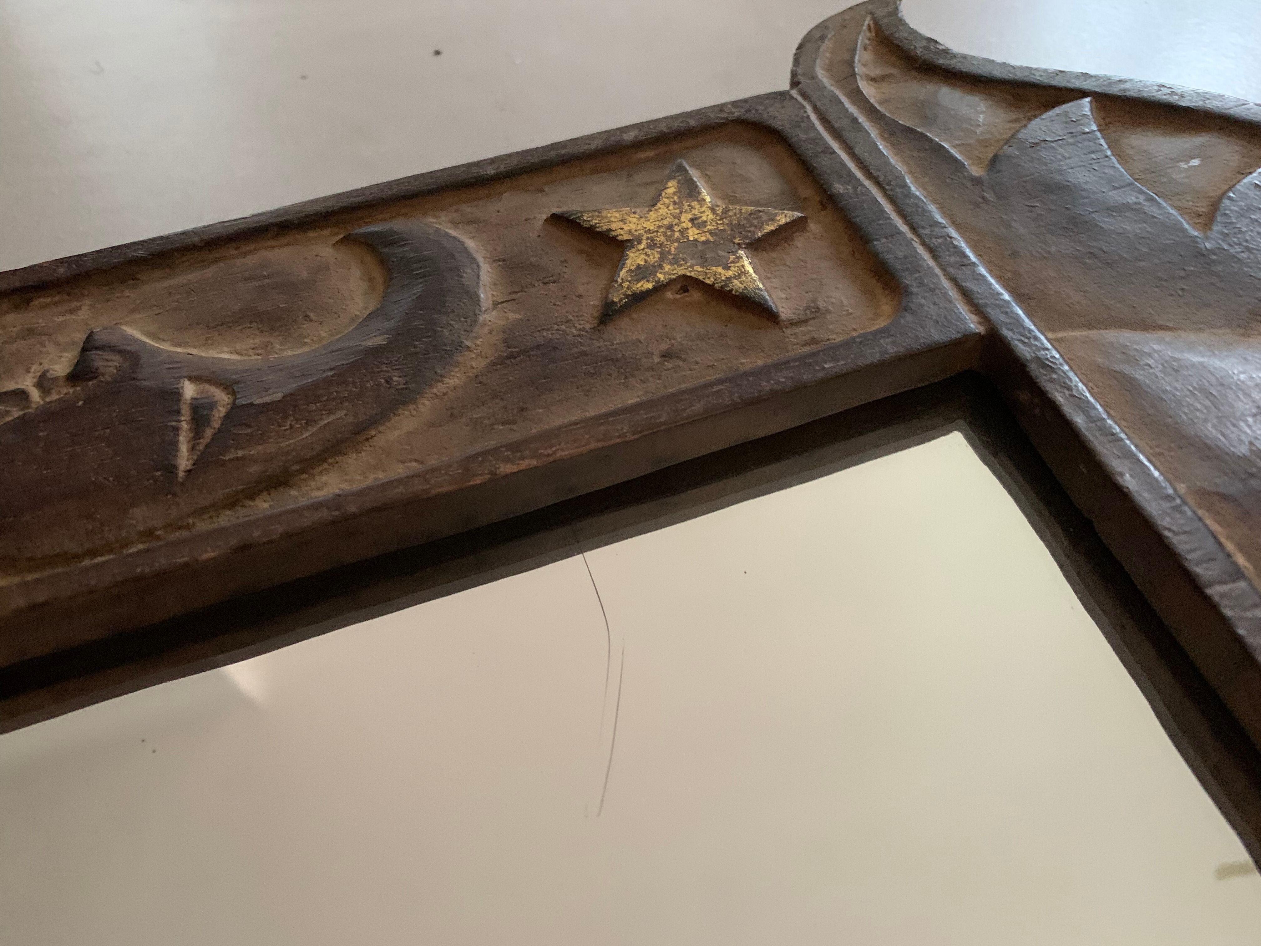 Antique carved wooden mirror