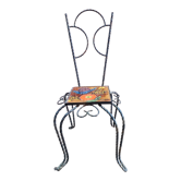 Wrought iron chair with enamelled plate signed Vallauris