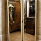 Two-panel screen in cream lacquered wood with bevelled mirrors.