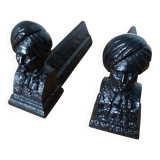 Cast iron andirons with character heads