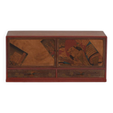 Small Japanese cabinet with sliding doors, Kabuki decoration, made of paulownia wood, early Showa period, circa 1926–1970.