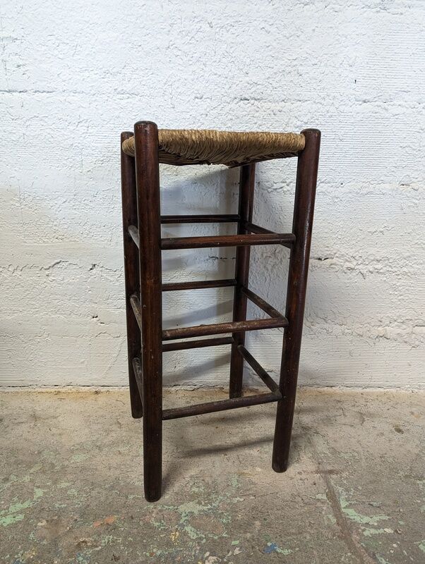 High wooden stool and straw