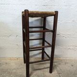 High wooden stool and straw