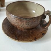 Set of 8 stoneware cups and a mug, shades of beige.
