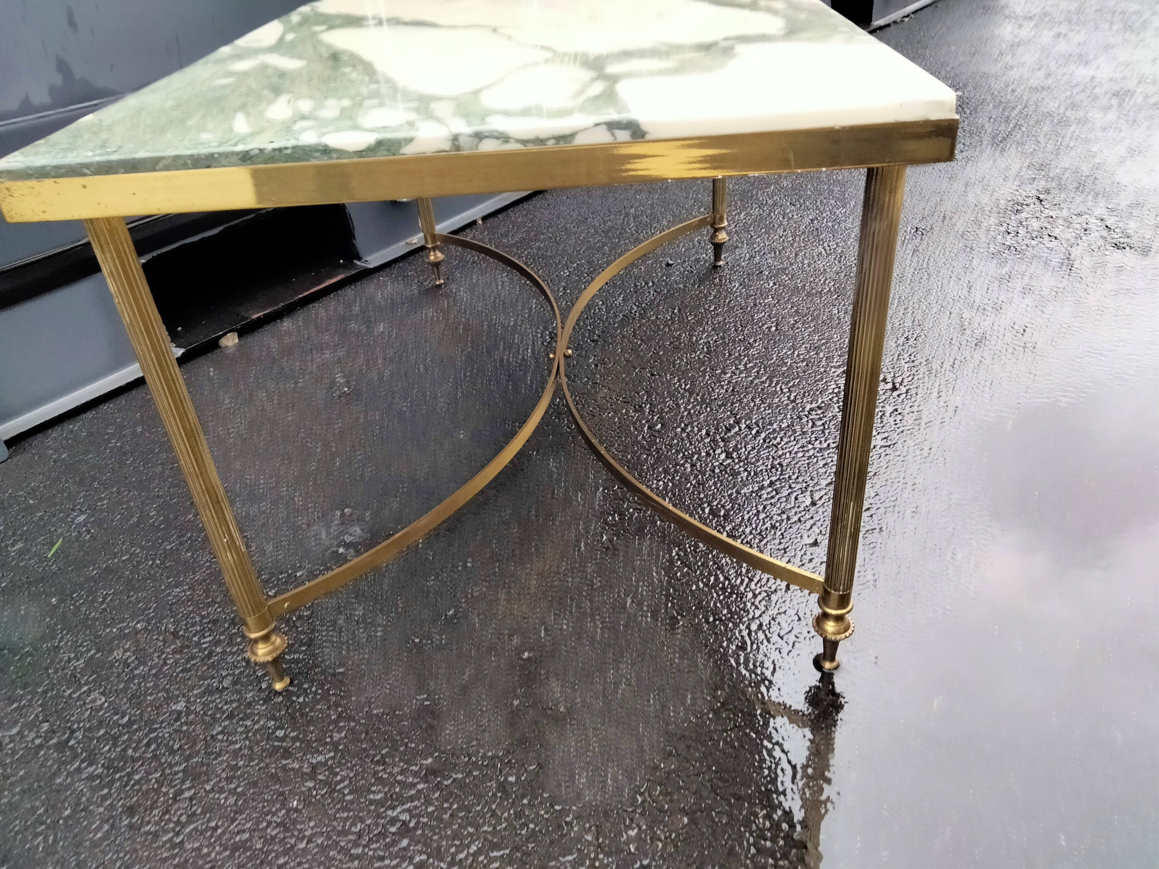 Old vintage gilded side table with marble top