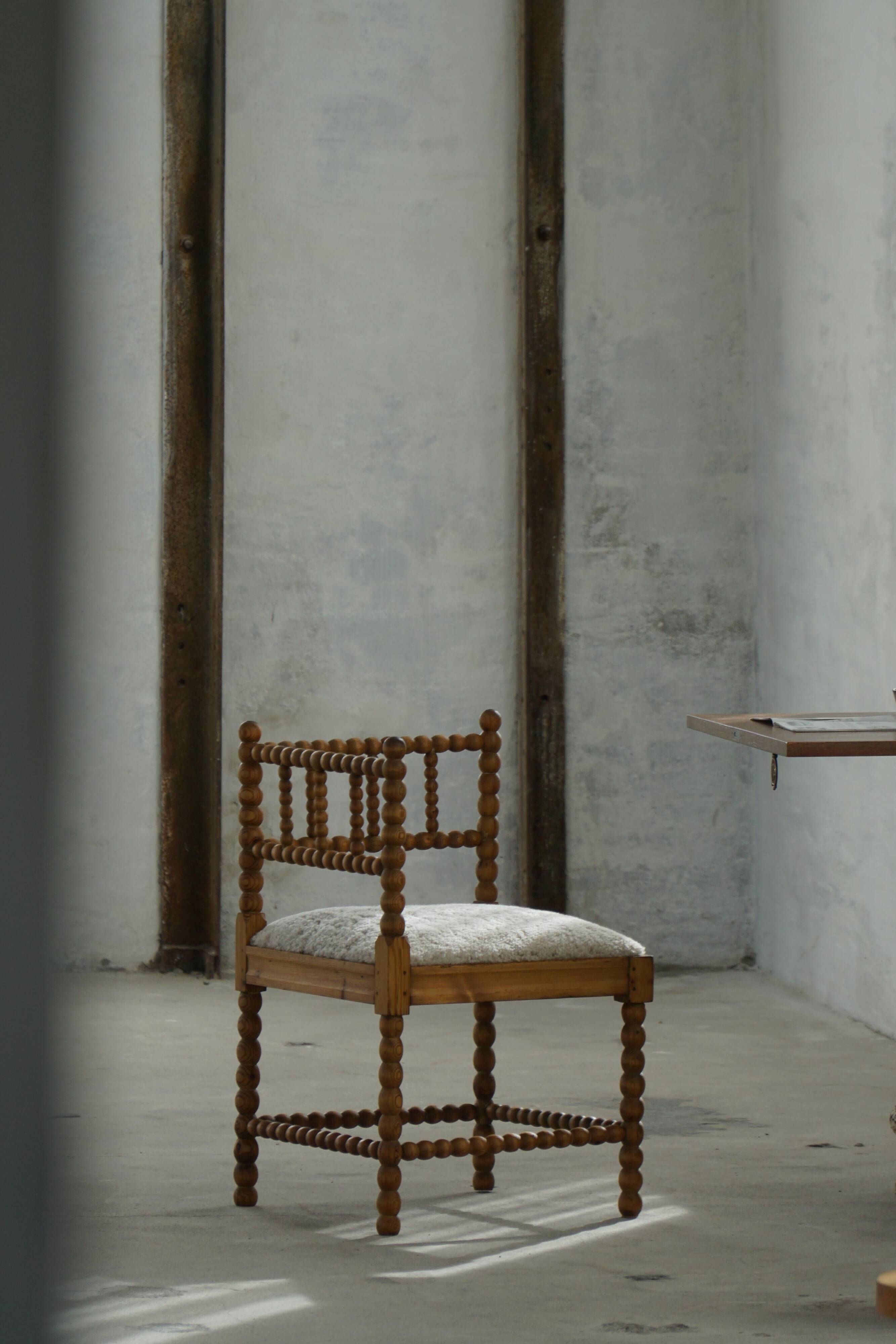 Antique French corner chair handcrafted with lamb's wool, early 20th century.