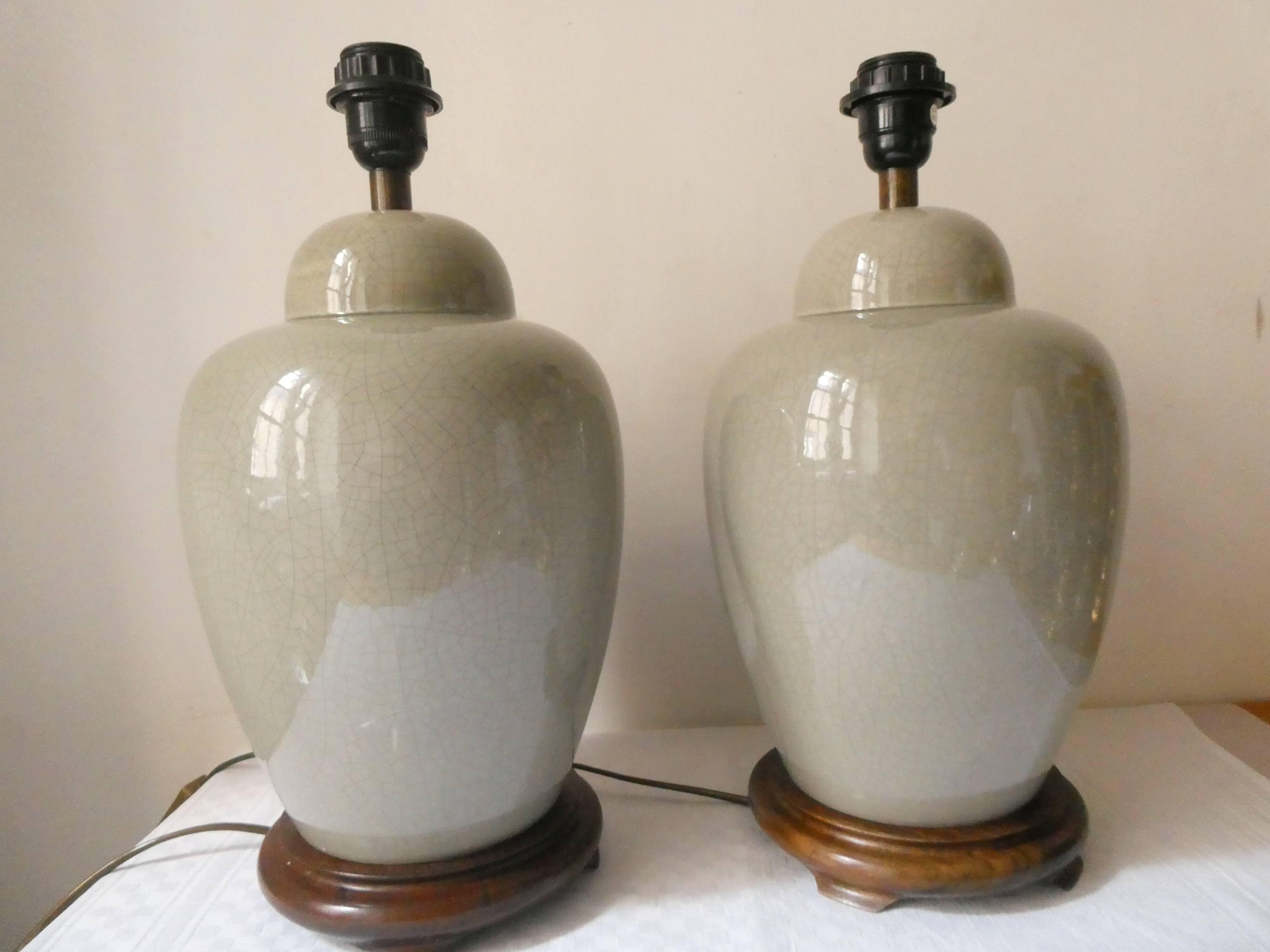Pair of celadon crackle ceramic lamp bases decorated with flowers.