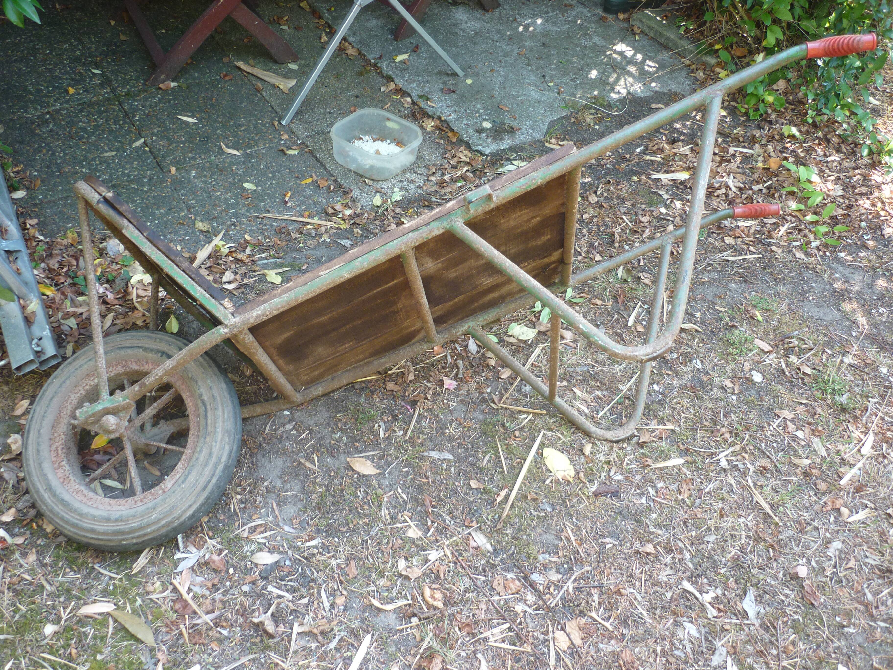 Former wooden and metal wheelbarrow