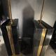 Pair of black lacquered and brass table lamps, circa 1970