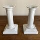 Pair of neo-classical Empire candlesticks from the late 19th century in white porcelain.