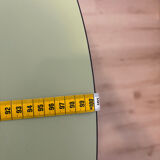 Round extendable folding Formica table with metal legs from the 50s/60s in green.
