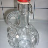Bottle with handle and mechanical cap