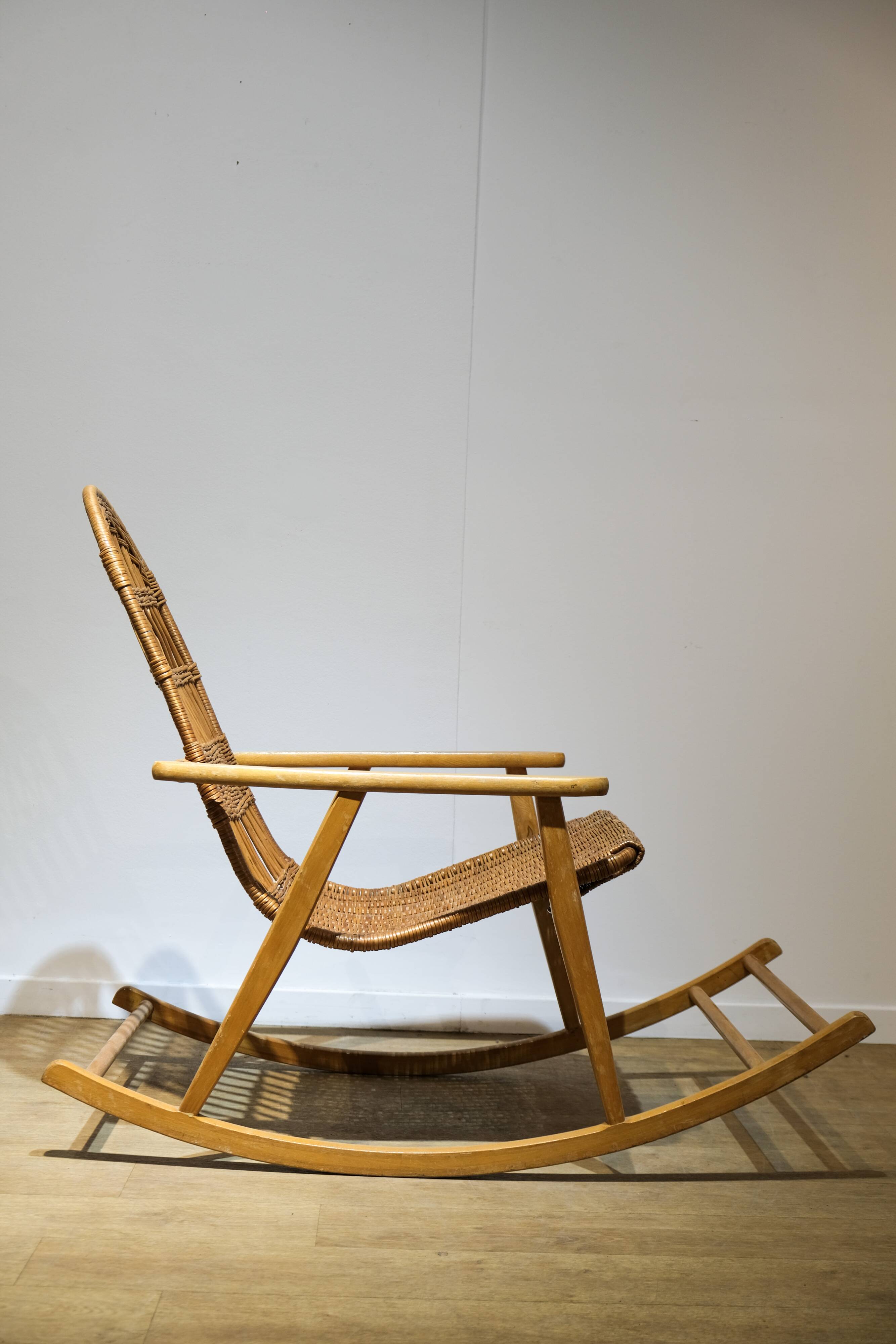 Wicker and wood rocking chair