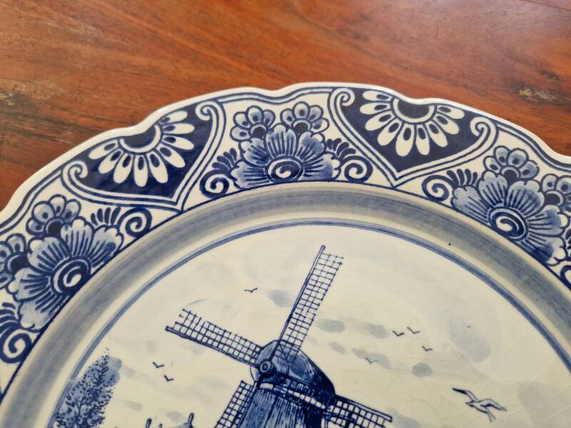 Delft Blue earthenware plate with a mill by a river decoration