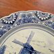 Delft Blue earthenware plate with a mill by a river decoration