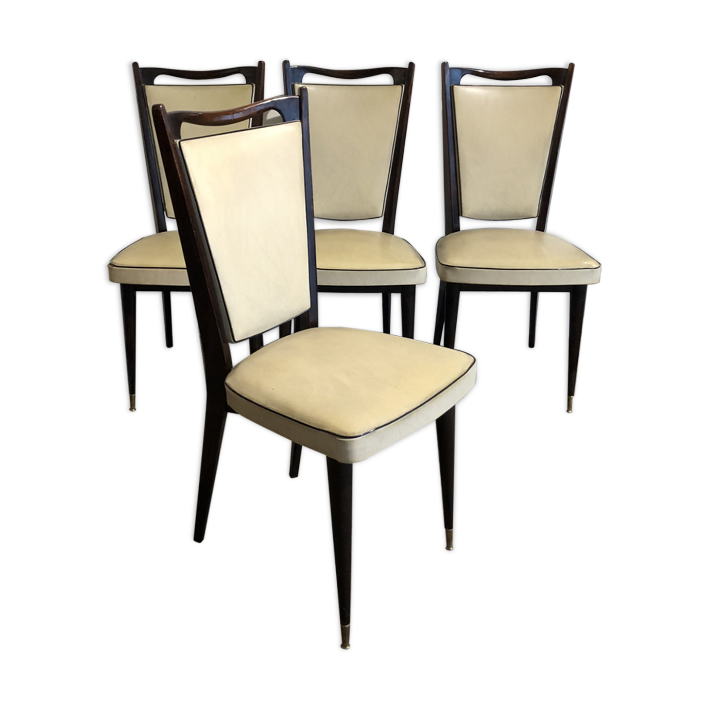 Four white leatherette chairs