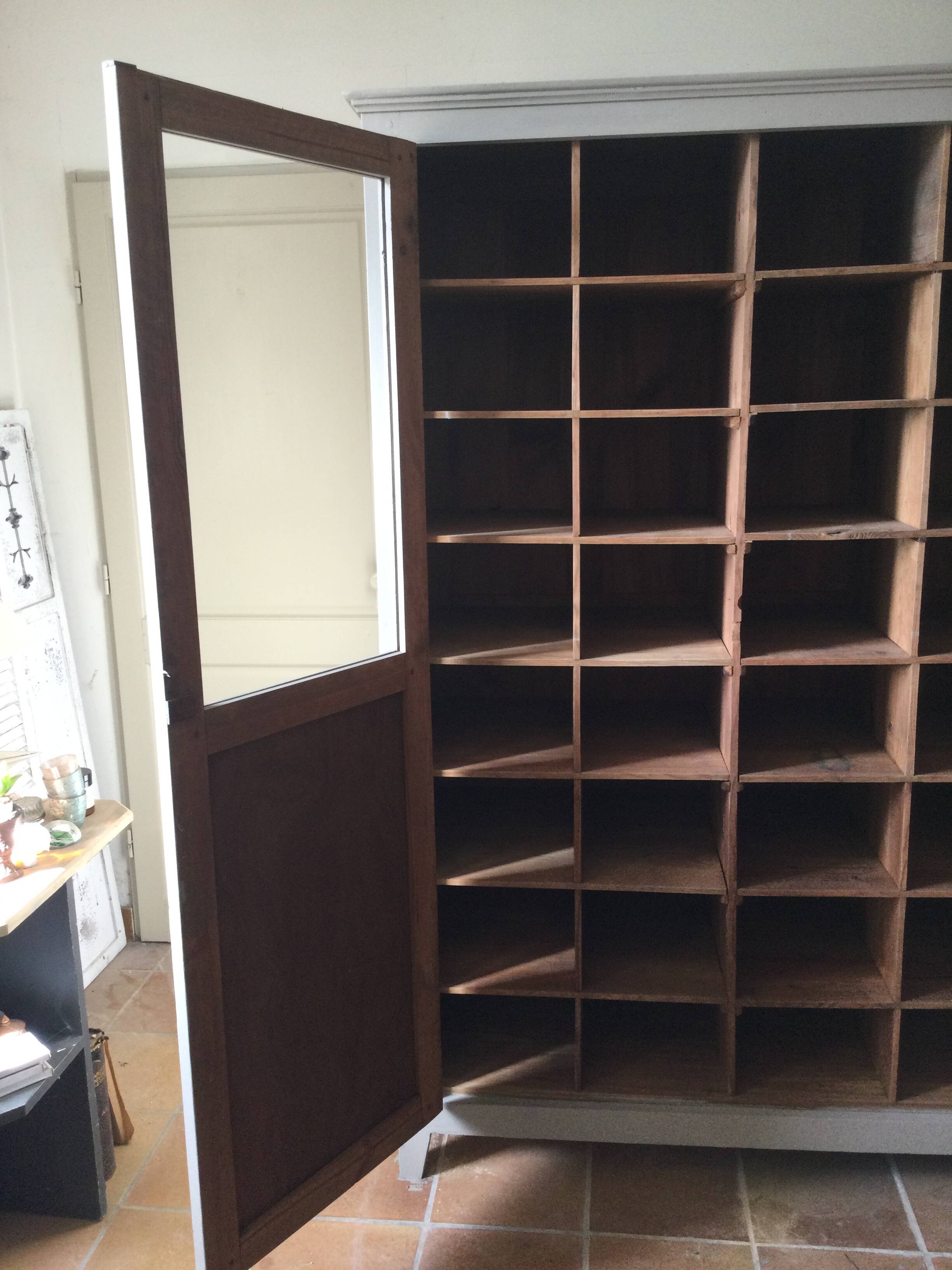 Antique Parisian wardrobe with interior compartments.
