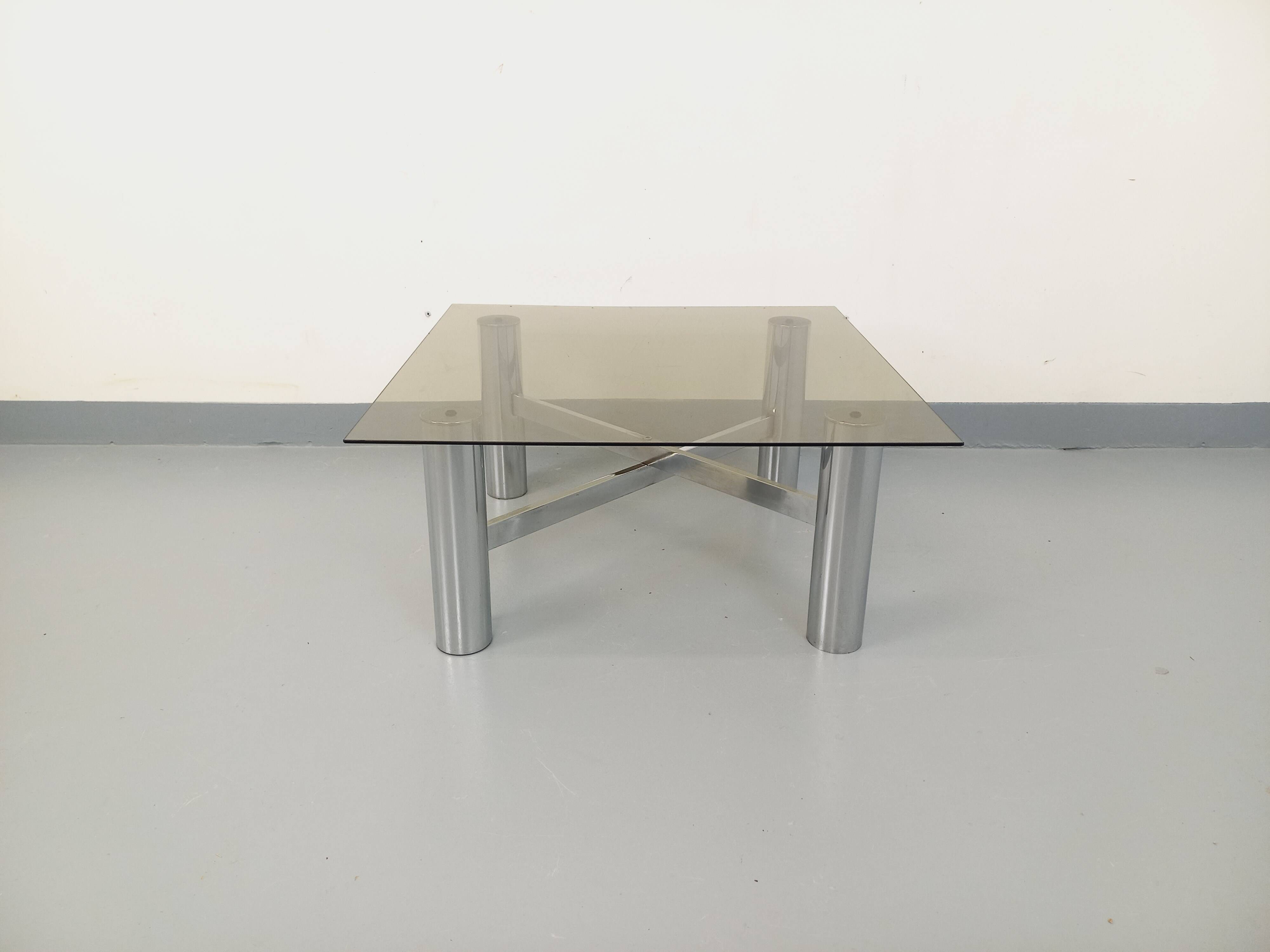 Square Italian vintage Space Age coffee table in smoked glass and metal.