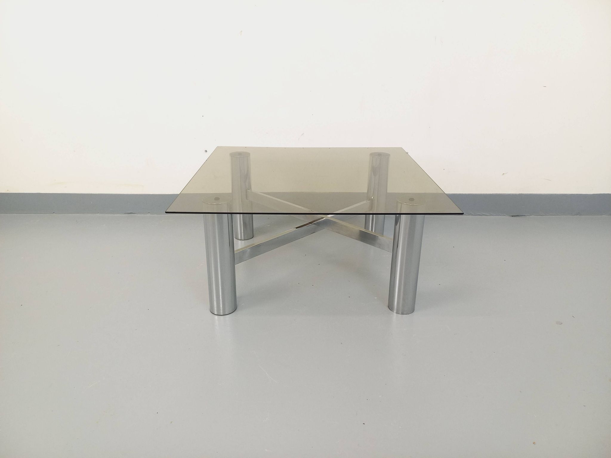 Square Italian vintage Space Age coffee table in smoked glass and metal.