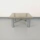 Square Italian vintage Space Age coffee table in smoked glass and metal.