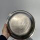 Round silver-plated metal serving dish with hallmark