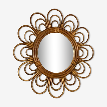 Sun mirror in arched rattan. 40cm. 1960.