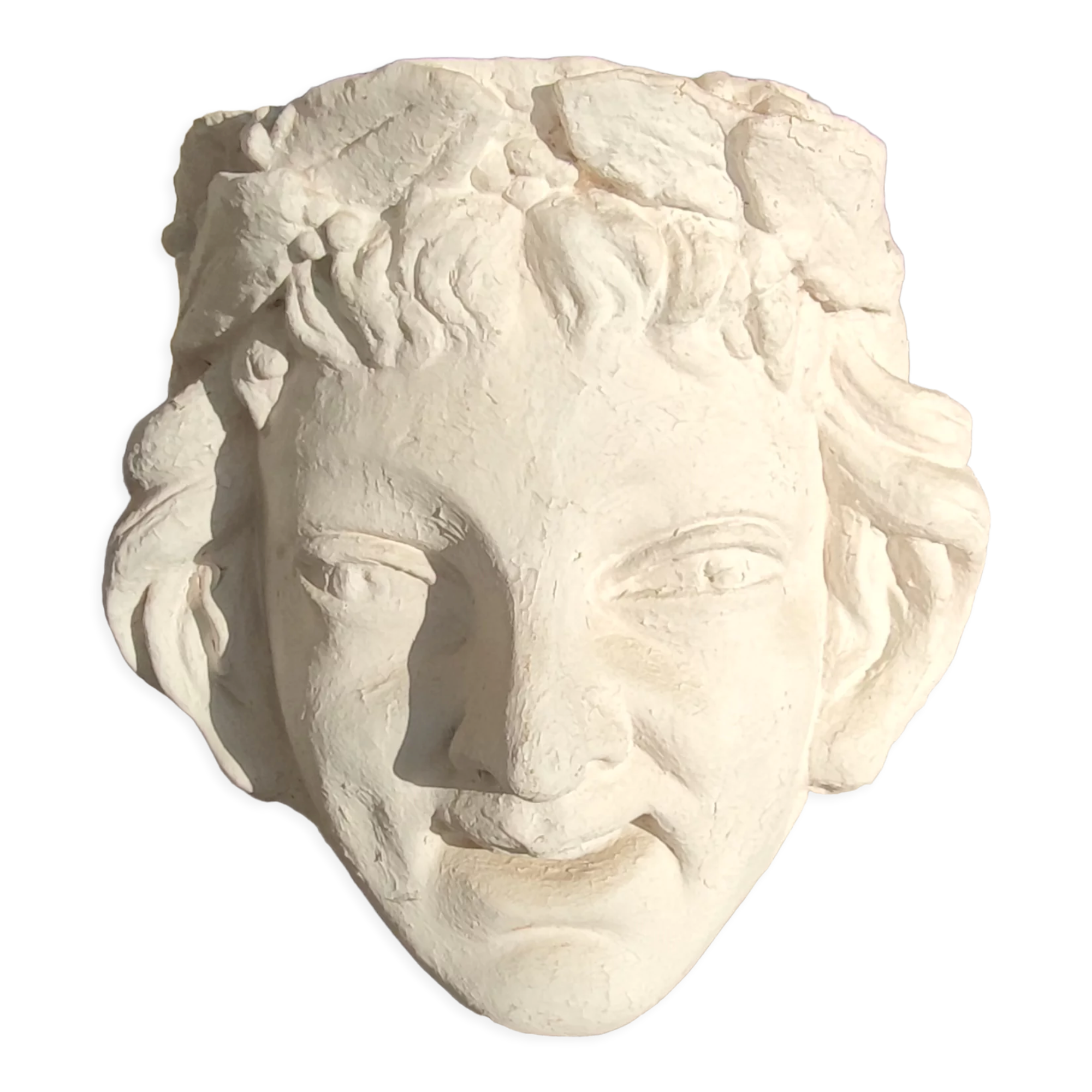 Old face in plaster antique decoration