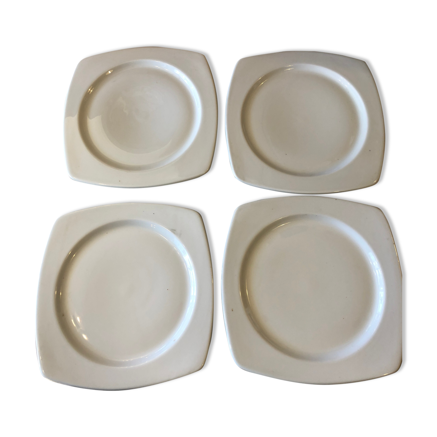 4 white porcelain plates