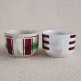 2 mismatched iron earth cups