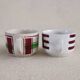 2 mismatched iron earth cups