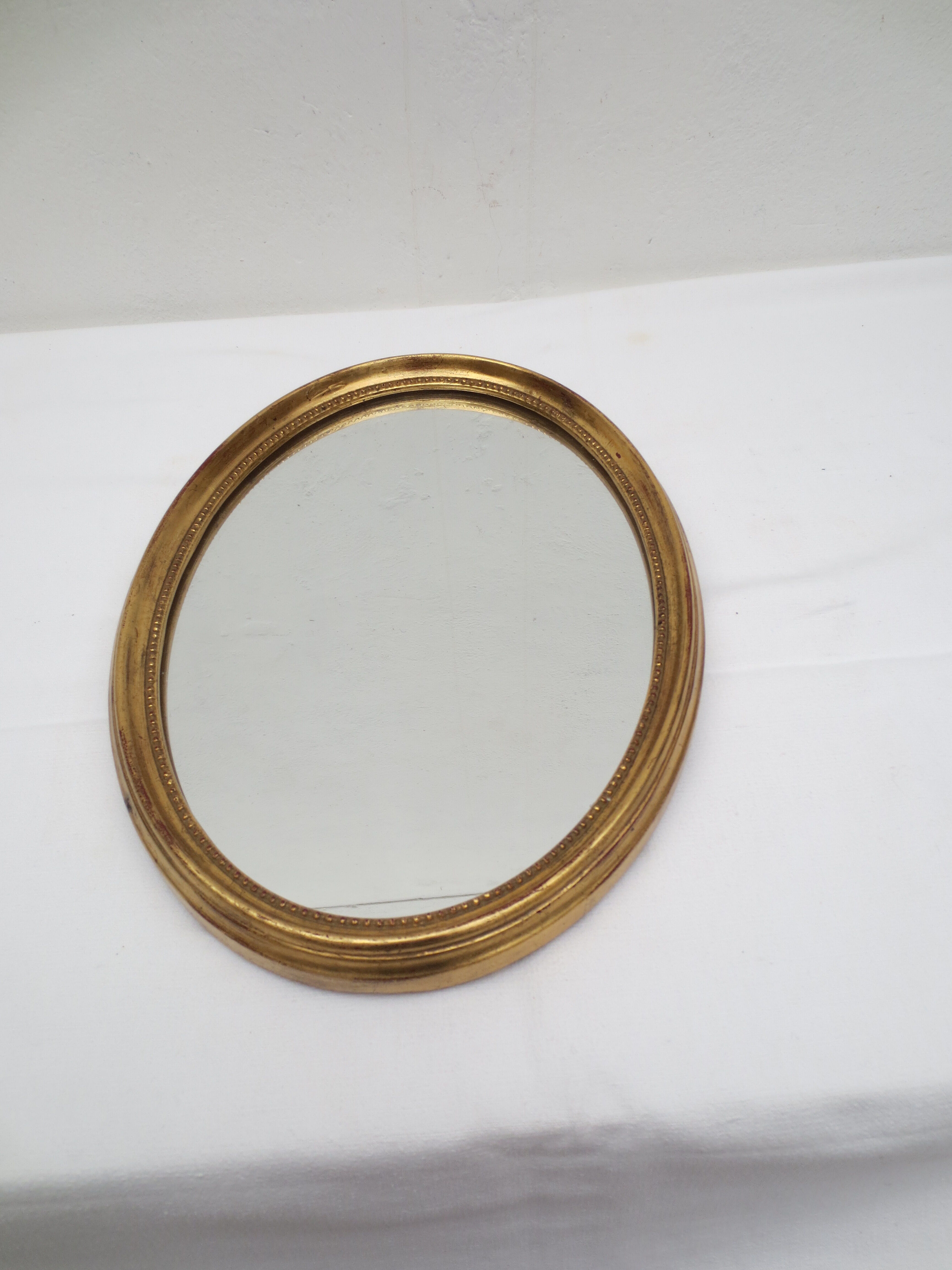 Oval wooden mirror gilded tower, medallion type