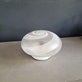 Frosted glass globe ceiling light with spiral patterns.
