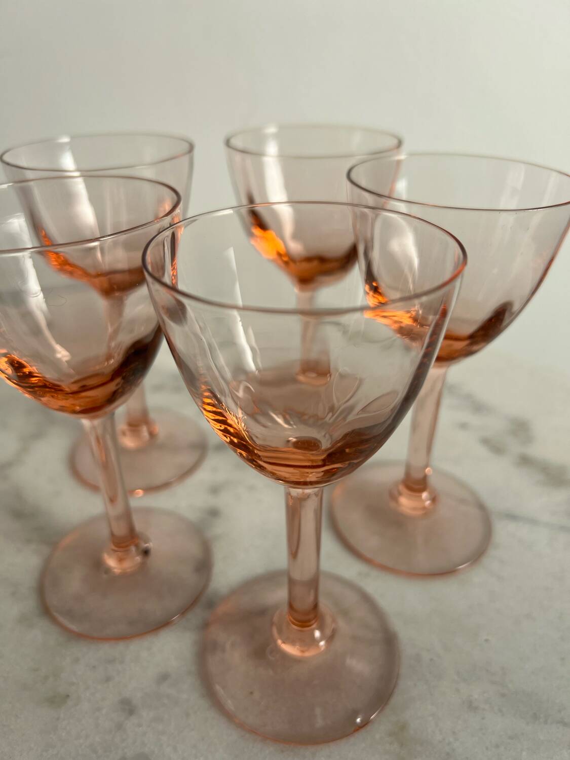 5 small pink glass stemmed glasses