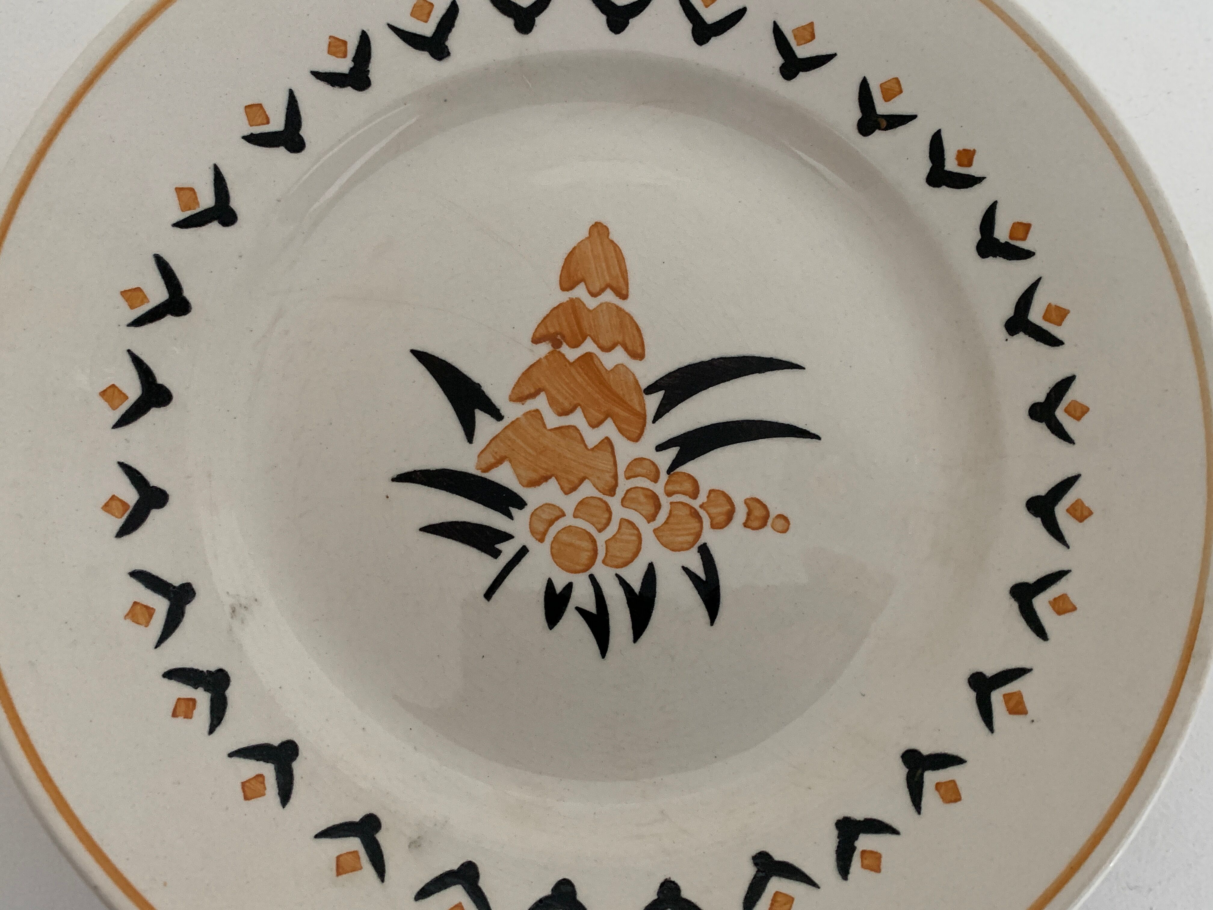 7 dessert plates and one Longwy dish
