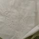 White cotton pillowcase with embroidery and monogram.