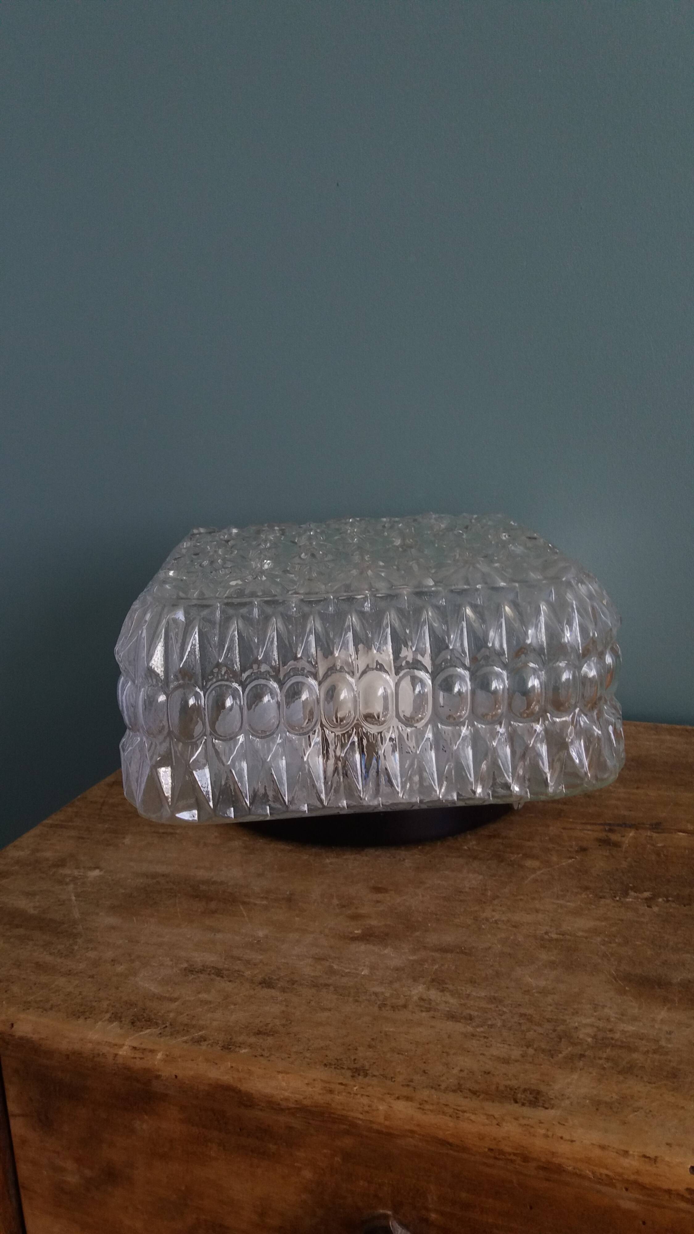 Square globe ceiling light in moulded glass.
