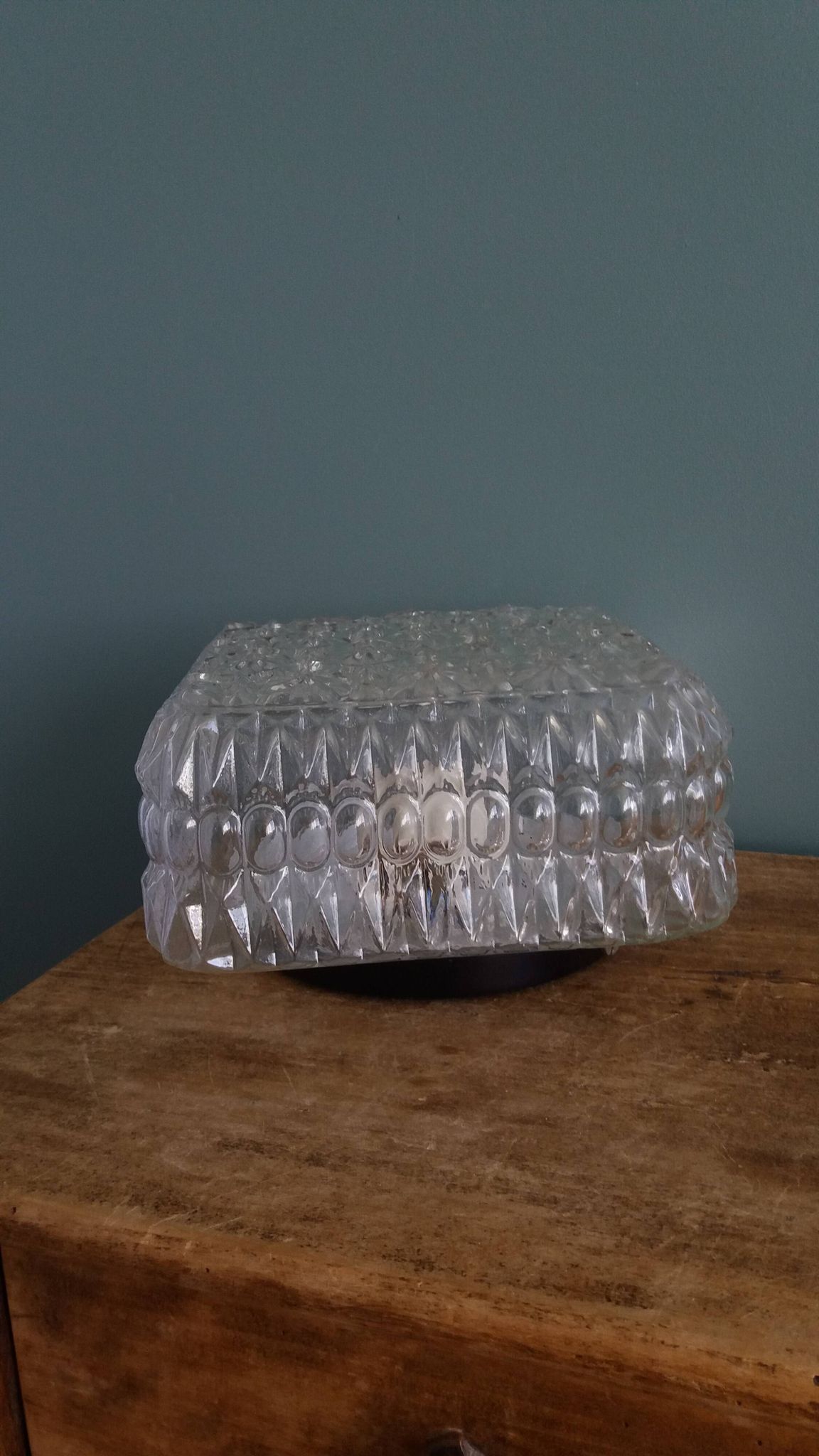 Square globe ceiling light in moulded glass.