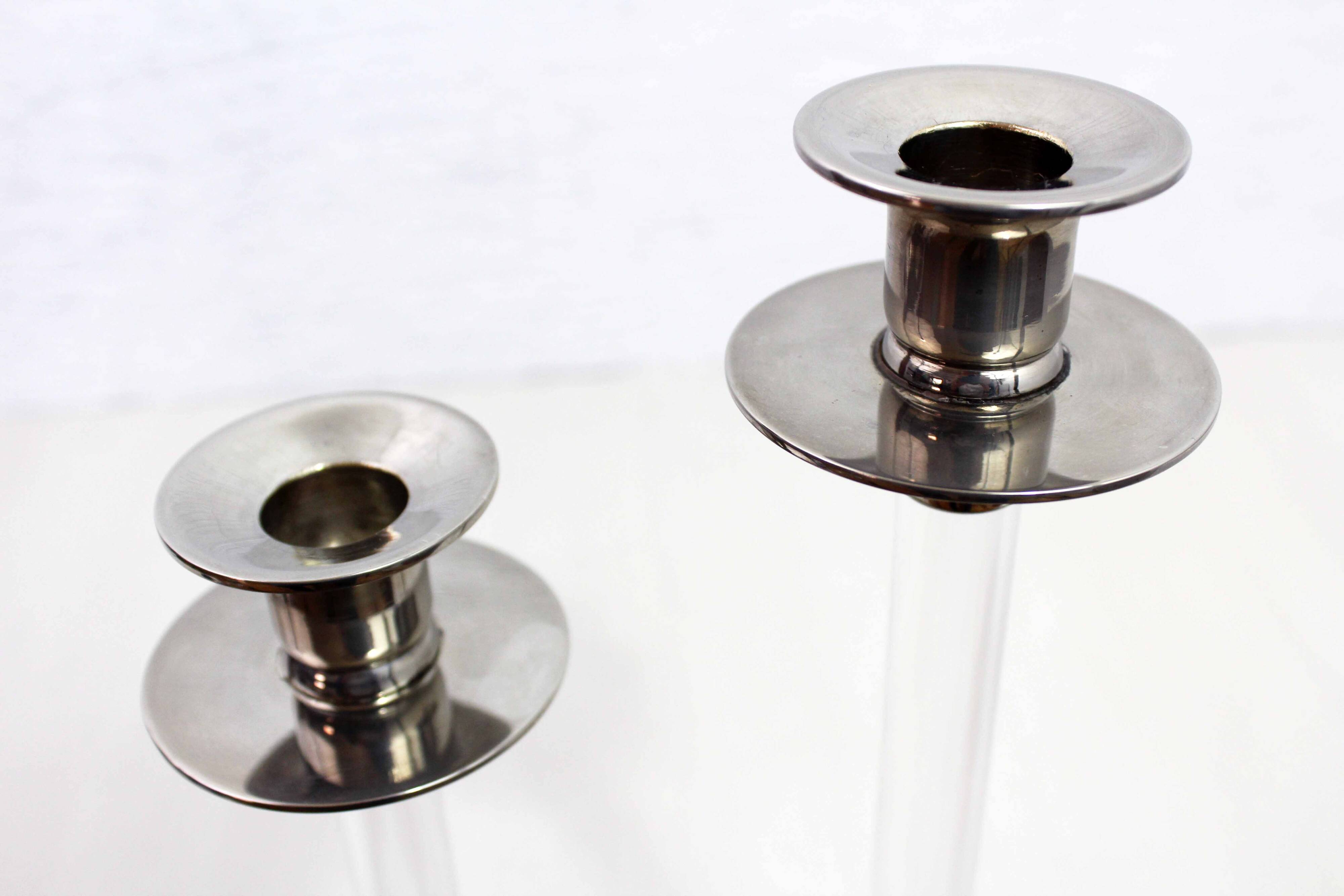 Pair of lucite and silver-plated metal candlesticks