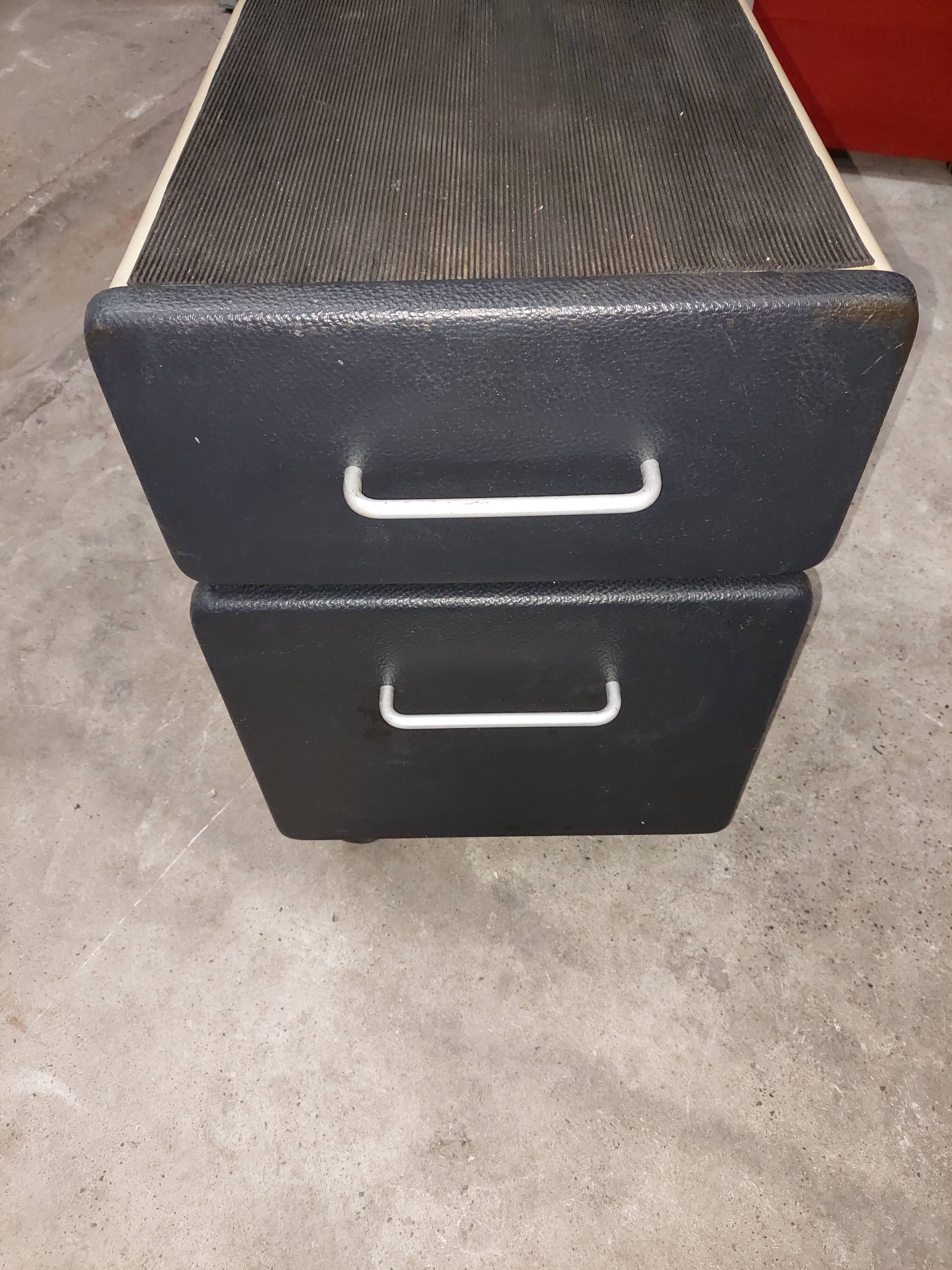 Metal box with used vintage keyless casters