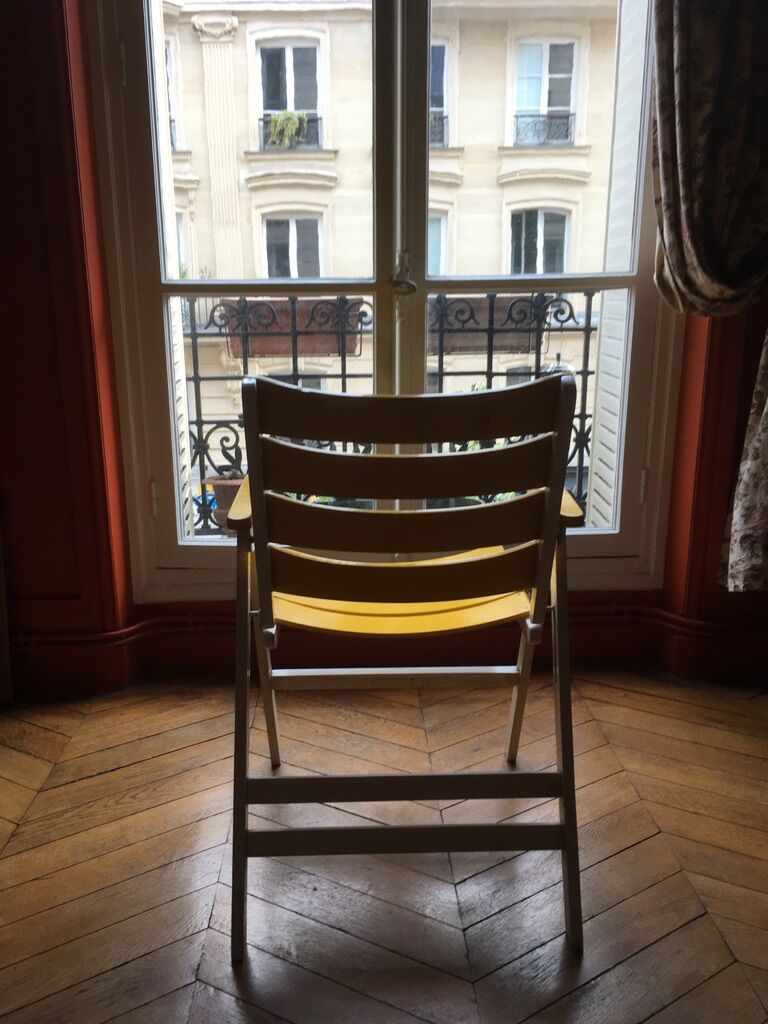 Vintage foldable wooden armchair