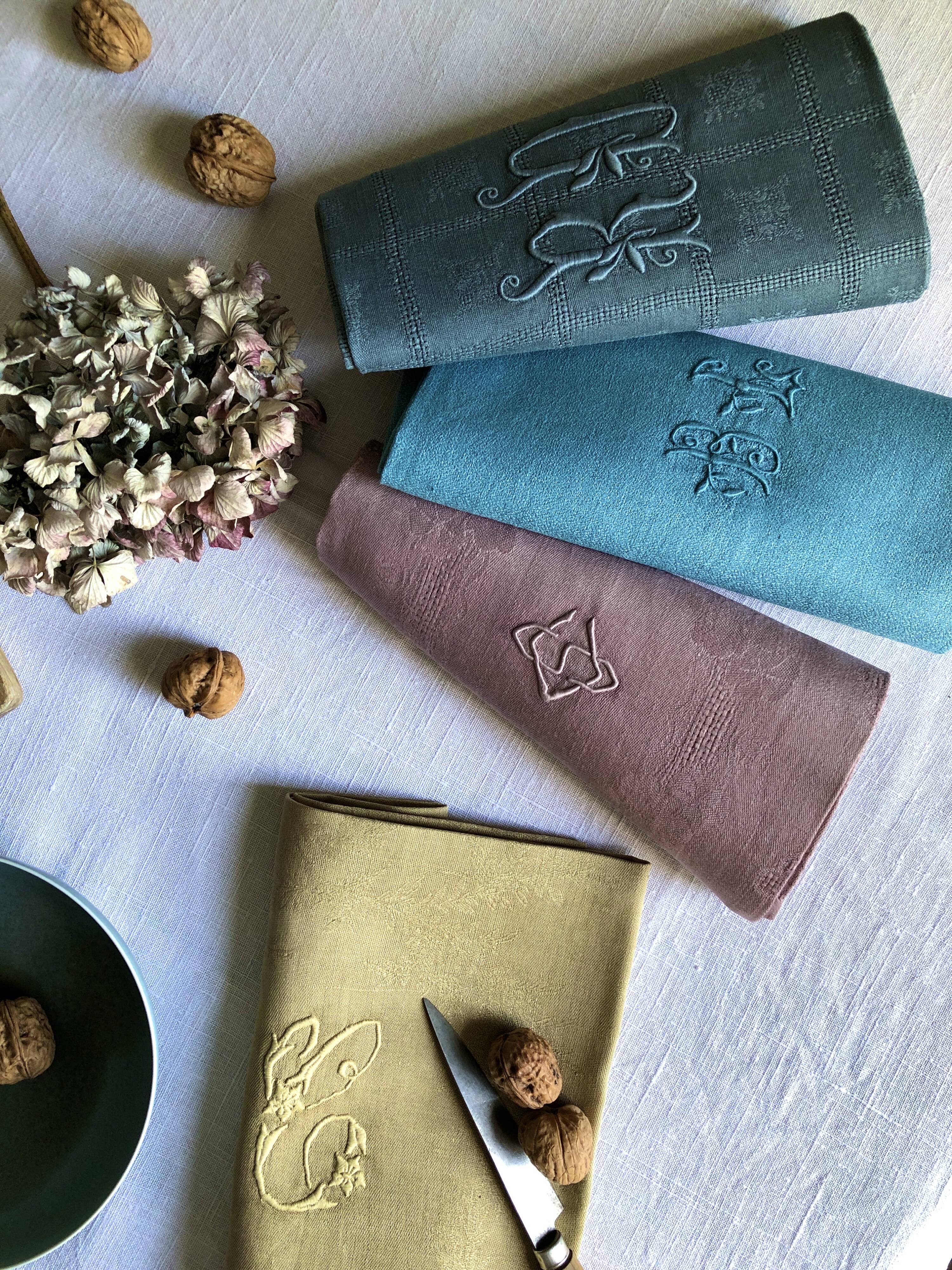 Suite of four tinted antique napkins