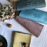 Suite of four tinted antique napkins