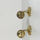 Pair of Guzzini brass spherical wall lights, 1970