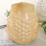 Vintage yellow pitcher in fruit slip