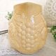 Vintage yellow pitcher in fruit slip