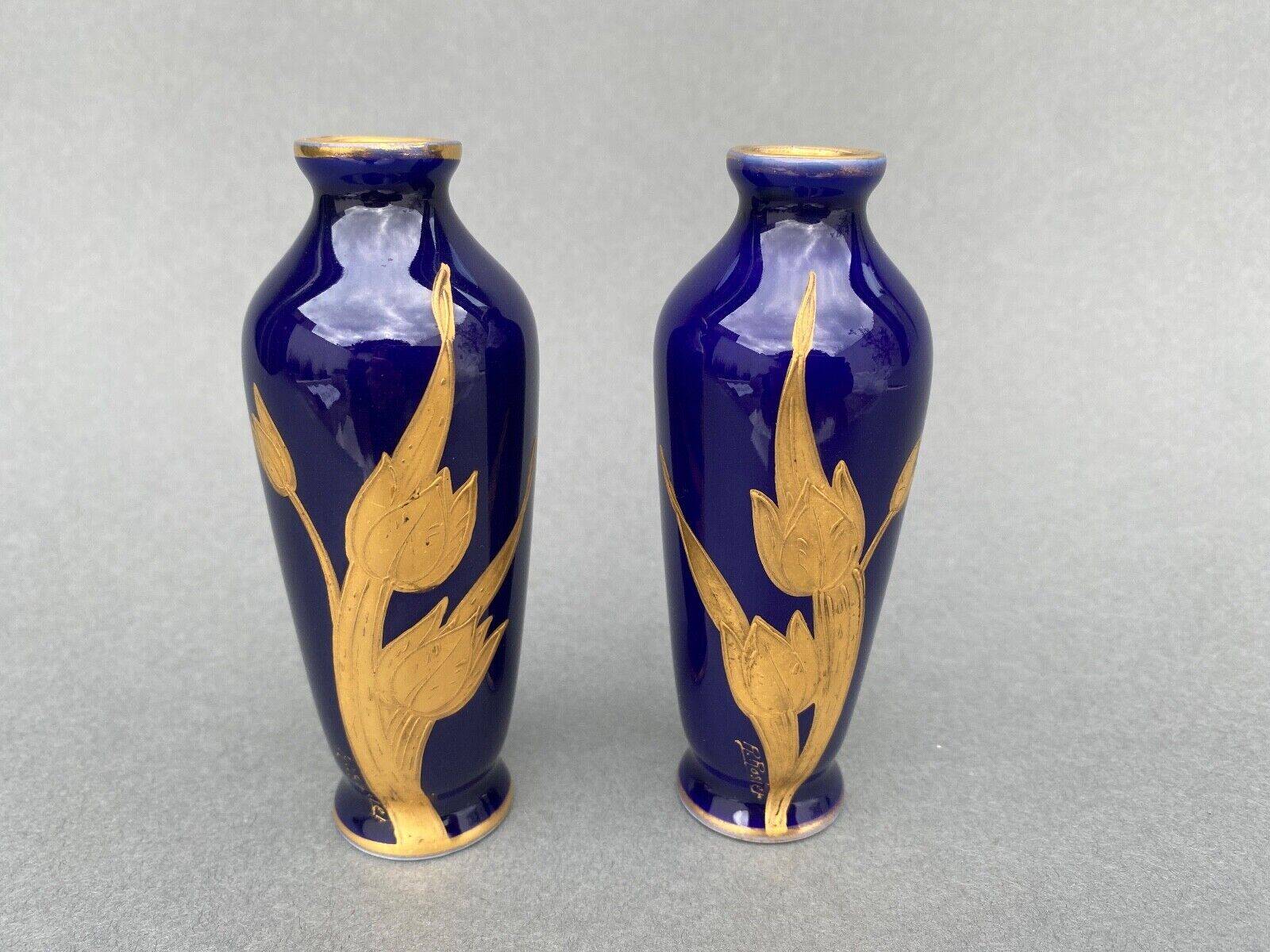 Pair of 1900 Limoges vases with blue background and gold highlights, R. Rosier decorations