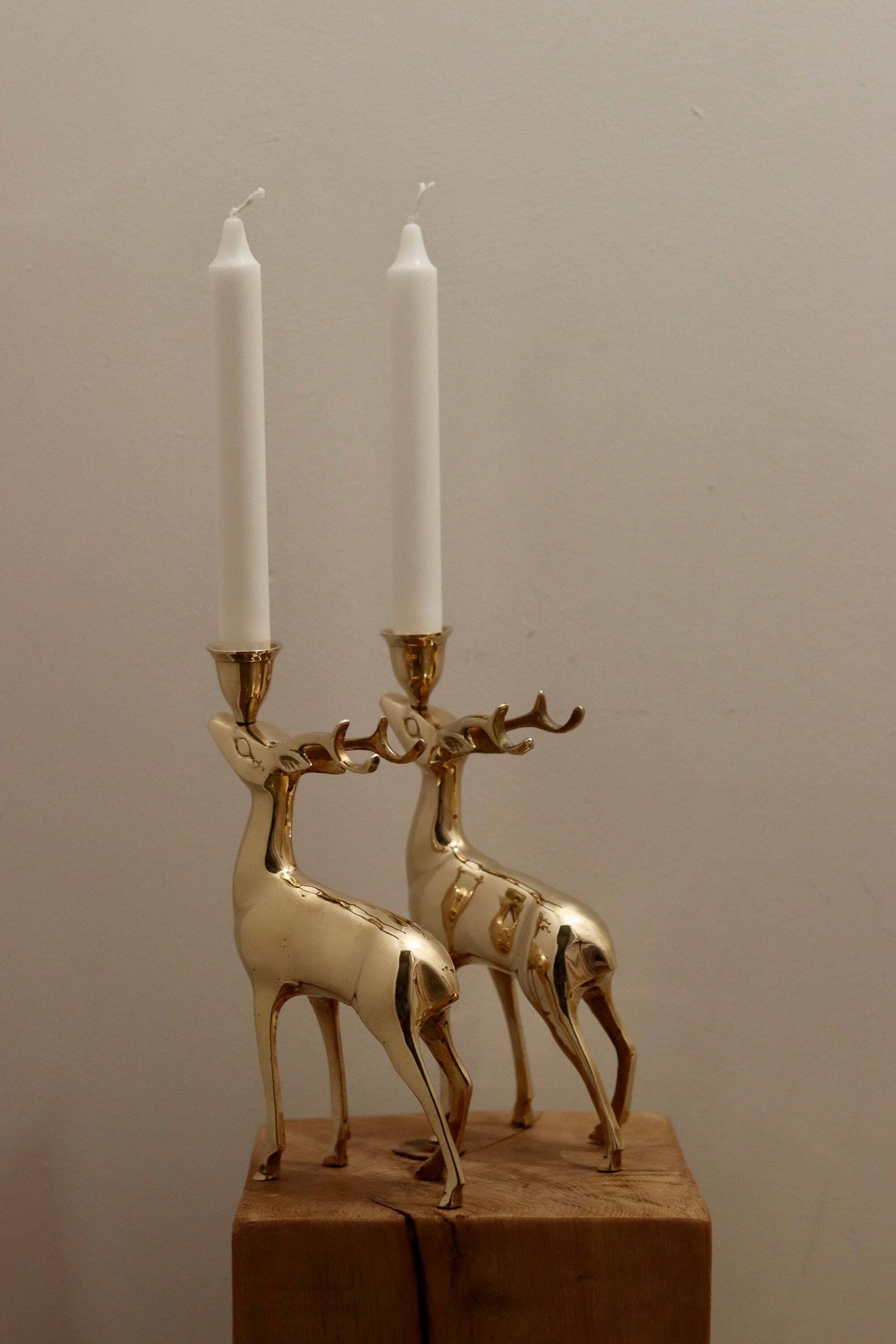 Pair of brass candle holders in the shape of deer from the mid-century.