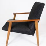 Easy chair with stool in teak and dark wool fabric of danish design from the 1960s.