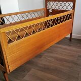 Rattan bed with compass feet